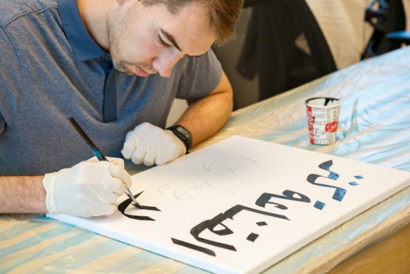 A CASA fellow in Amman at a calligraphy workshop.