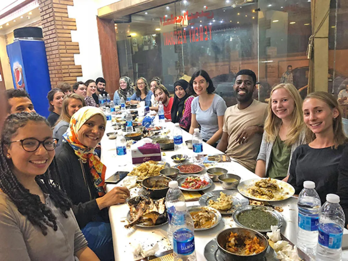 Event members sit at an orientation dinner.