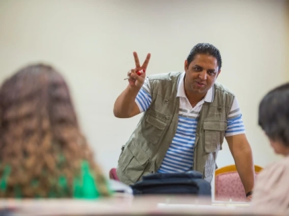 man with two fingers up