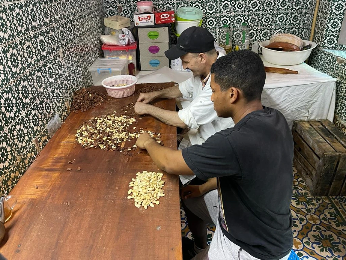 A student and community member handling food.